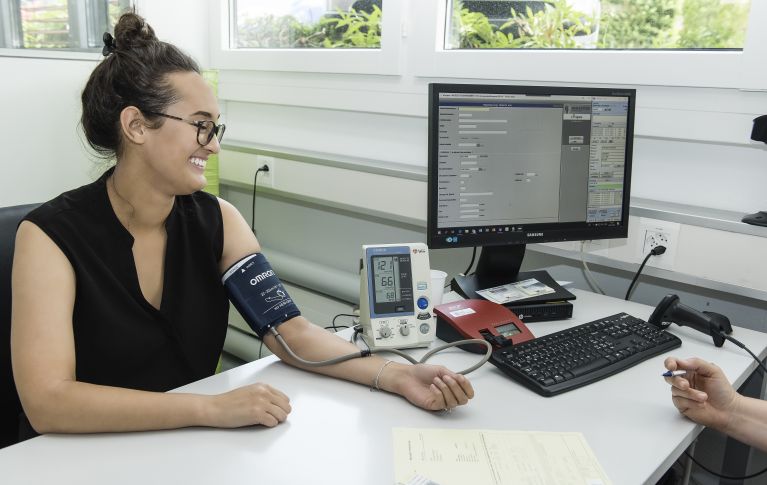 Woman having her blood pressure taken.